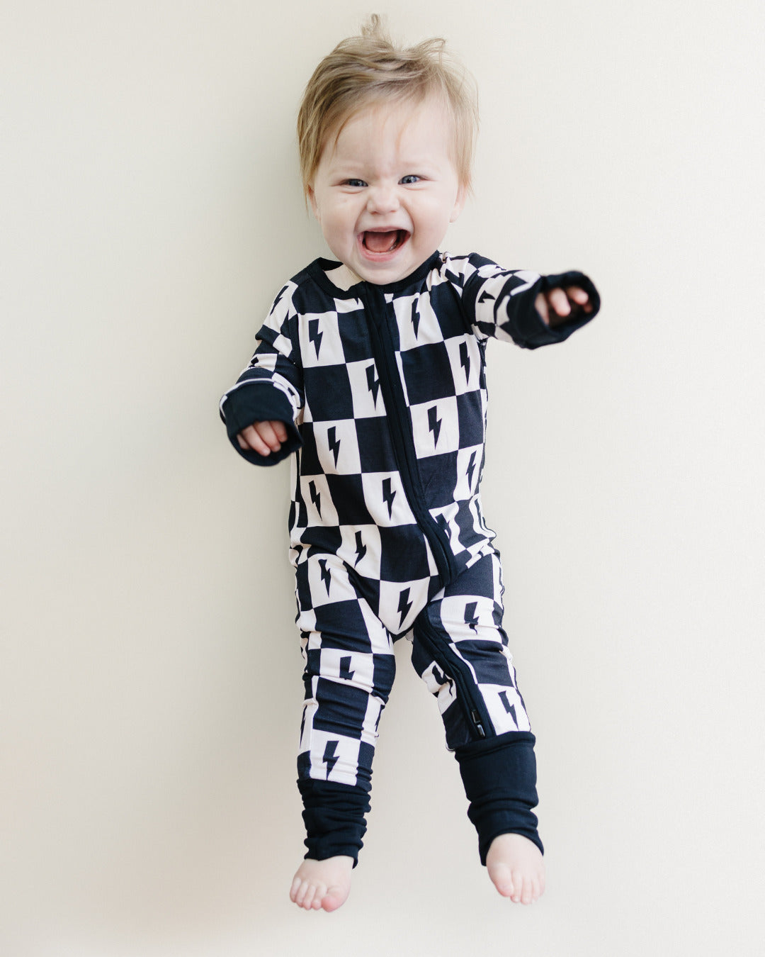 Baby Bamboo Zip Romper with Cream and Black Checkered Pattern and Bolts