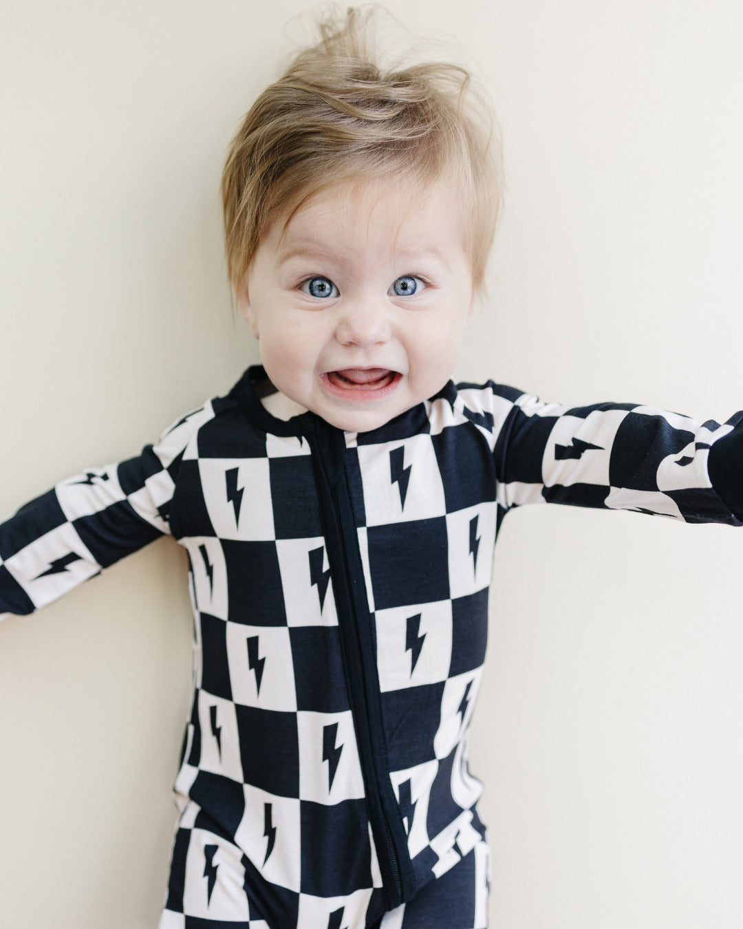 Baby Bamboo Zip Romper with Cream and Black Checkered Pattern and Bolts